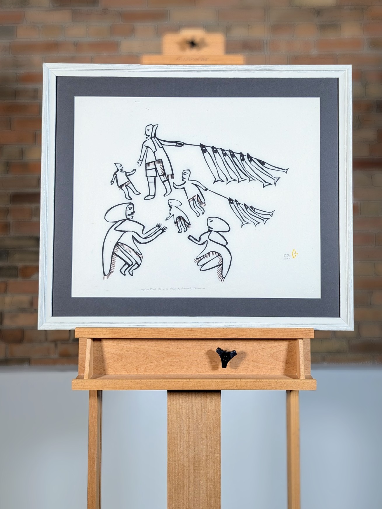 Drying Fish, a limited edition print by Baker Lake Inuit artist Jessie Oonark - on easel