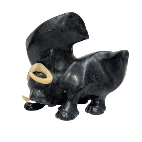 An small Muskox carving by an unknown Inuit artist - made of stone and muskox antler