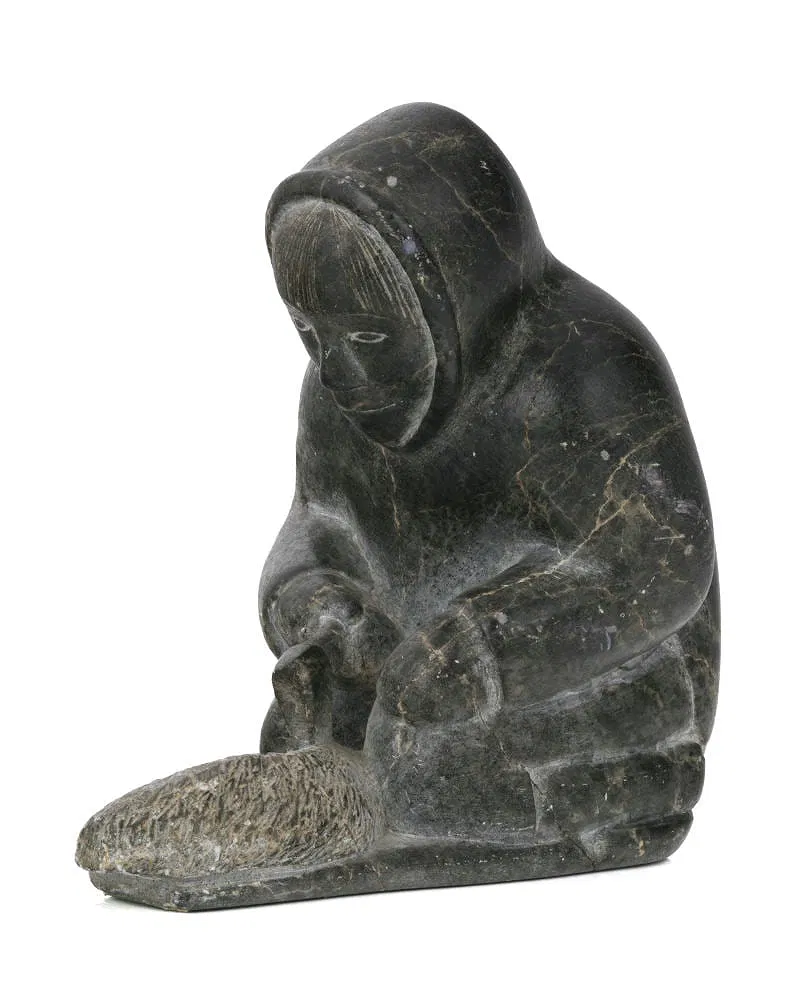 Man Carving a Qulliq (Kudlik) - sculpture by Inuit artist Kalingo - view 1